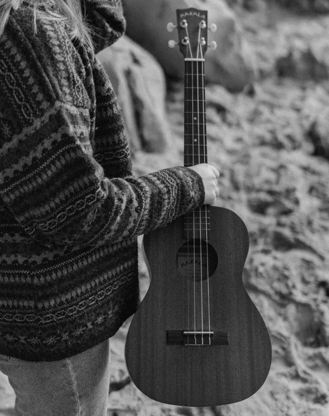 Woman carrying a Makala Ukulele outdoors